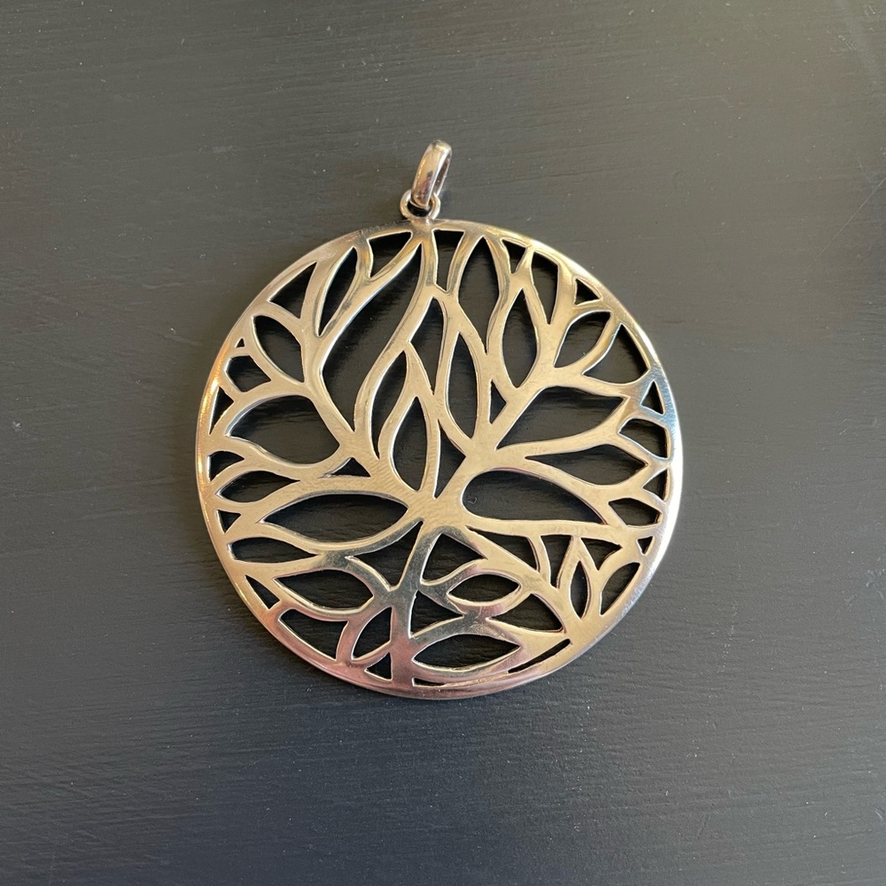 Large sterling silver leaf motif pendant.
